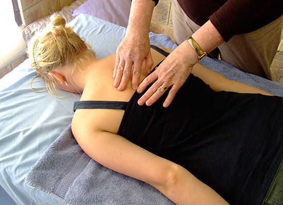 Joan performing a Bowen Treatment
