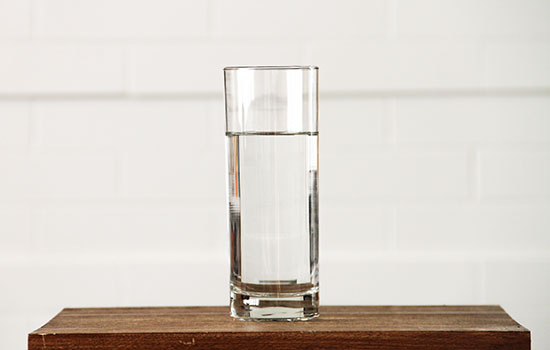 Clean glass of water on wood table